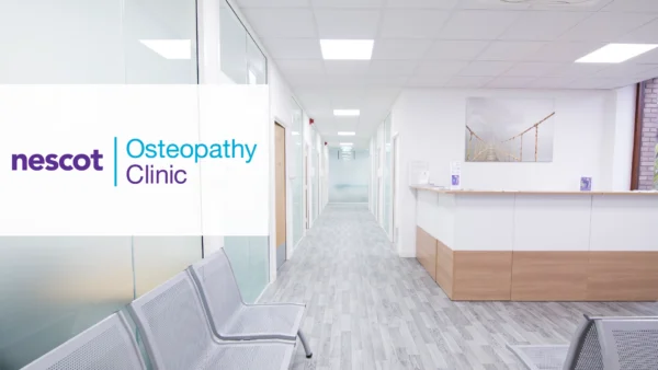 A bright osteopathy clinic reception area with a white and wood reception desk, grey seating, frosted glass consultation rooms, and a framed photograph of a suspension bridge on the wall. The Nescot Osteopathy Clinic logo is displayed on the left side of the image.