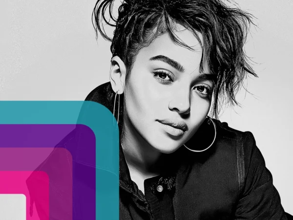 Black-and-white close-up portrait of a person wearing hoop earrings and a dark jacket, with short textured hair and layered colour shapes overlay on the left.
