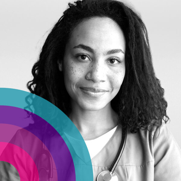 Close-up portrait of a person with curly shoulder-length hair and freckles, looking at the camera, with overlapping colourful circular graphics in the lower left corner on a light background.