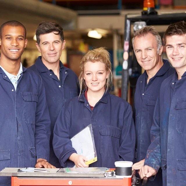 Portrait Of Staff Standing In workshop