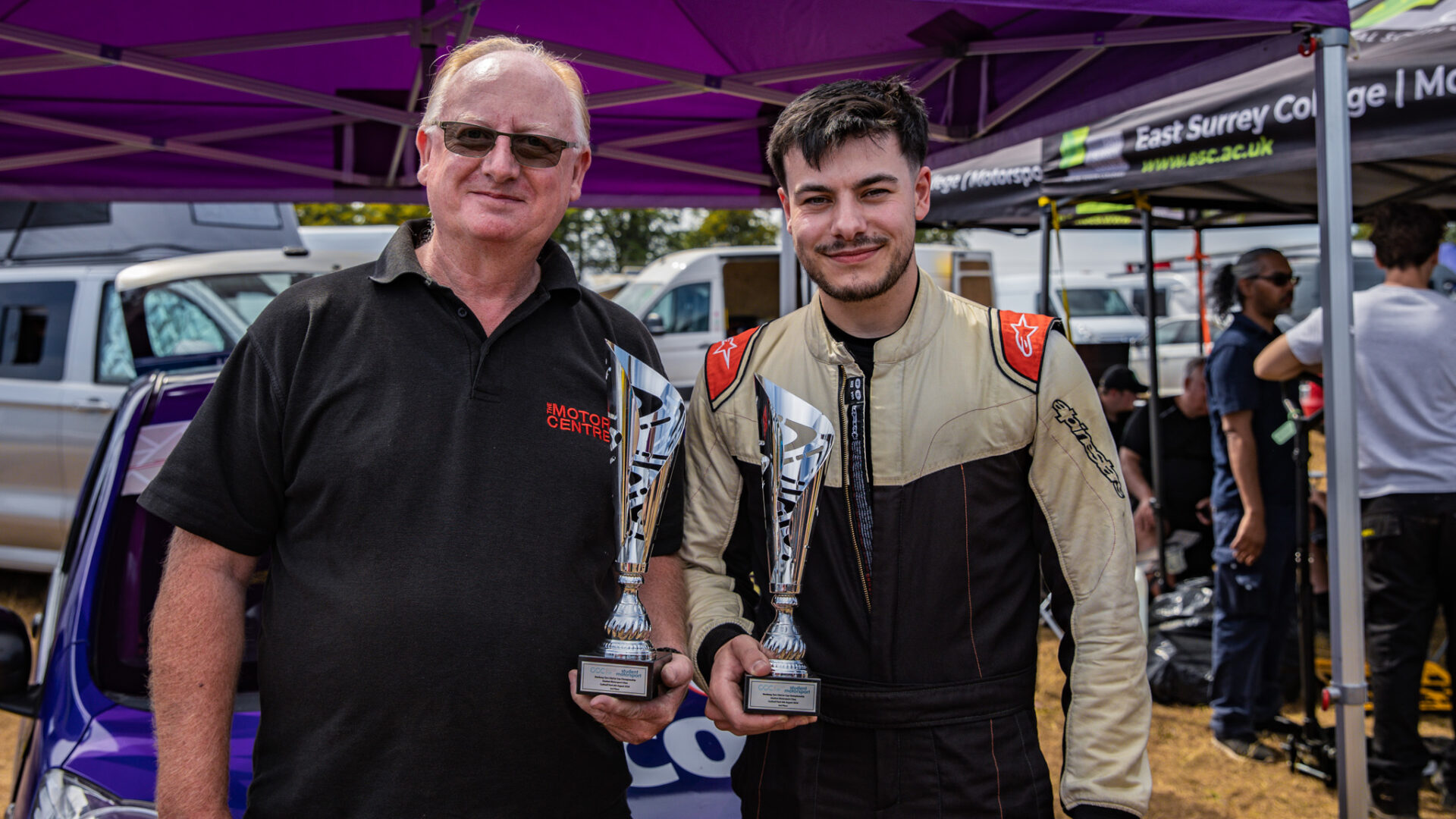 Nescot driver Elliot Lettis and Curriculum Manager George Keith pose with the trophies won at Cadwell Park as part of the Student Motorsport Competition.