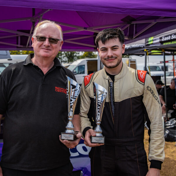 Nescot driver Elliot Lettis and Curriculum Manager George Keith pose with the trophies won at Cadwell Park as part of the Student Motorsport Competition.
