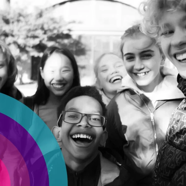 Group of young teenagers smiling and laughing.