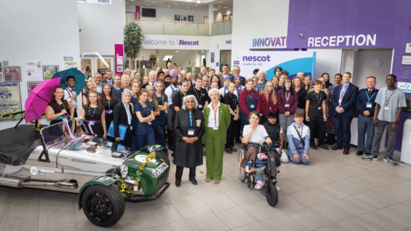 His Majesty’s Lord-Lieutenant of Surrey, Mrs Neelam Dharni Devesher MBE stands next to Nescot’s Principal and CEO, Julie Kapsalis MBE, in a group photo with the 25 Deputy Lieutenants, as well as Nescot students and staff participating in the civic engagement event