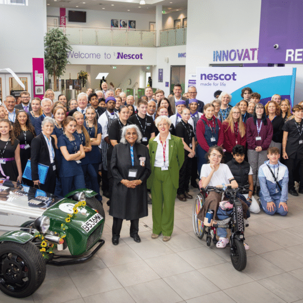 His Majesty’s Lord-Lieutenant of Surrey, Mrs Neelam Dharni Devesher MBE stands next to Nescot’s Principal and CEO, Julie Kapsalis MBE, in a group photo with the 25 Deputy Lieutenants, as well as Nescot students and staff participating in the civic engagement event