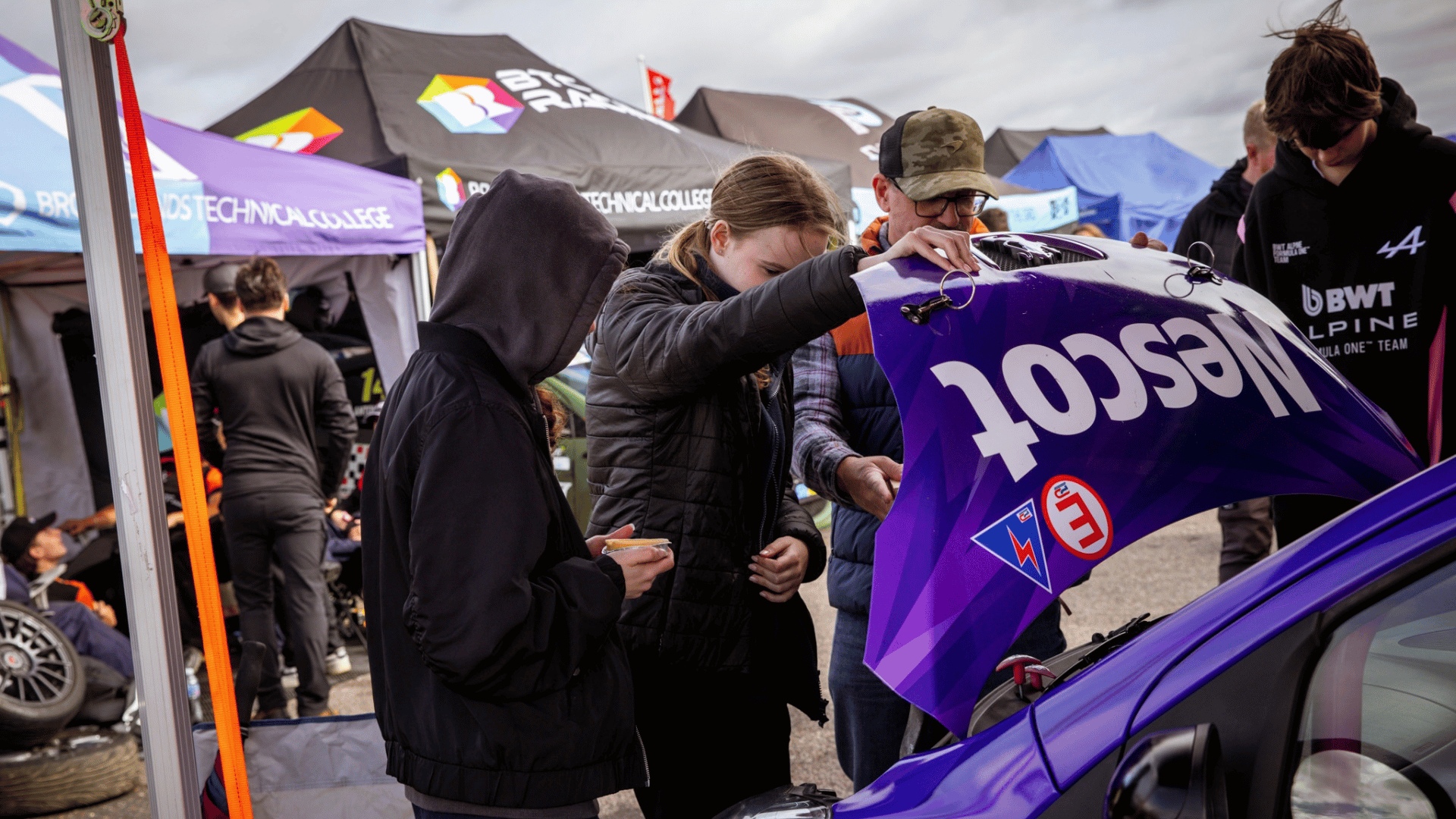 Nescot Motorsport students and tutors prepare the Nescot Motorsport racecar in the paddock at the Snetterton Circuit
