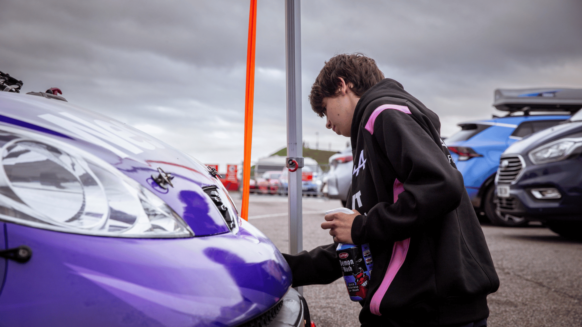 Nescot Motorsport students and tutors prepare the Nescot Motorsport racecar in the paddock at the Snetterton Circuit